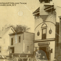 Postcard of the old firehouse and truck