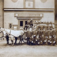 Horse-drawn fire patrol in front of the old fire house