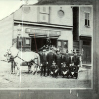 Horse-drawn Harrison Fire Patrol posing outside of the old fire house